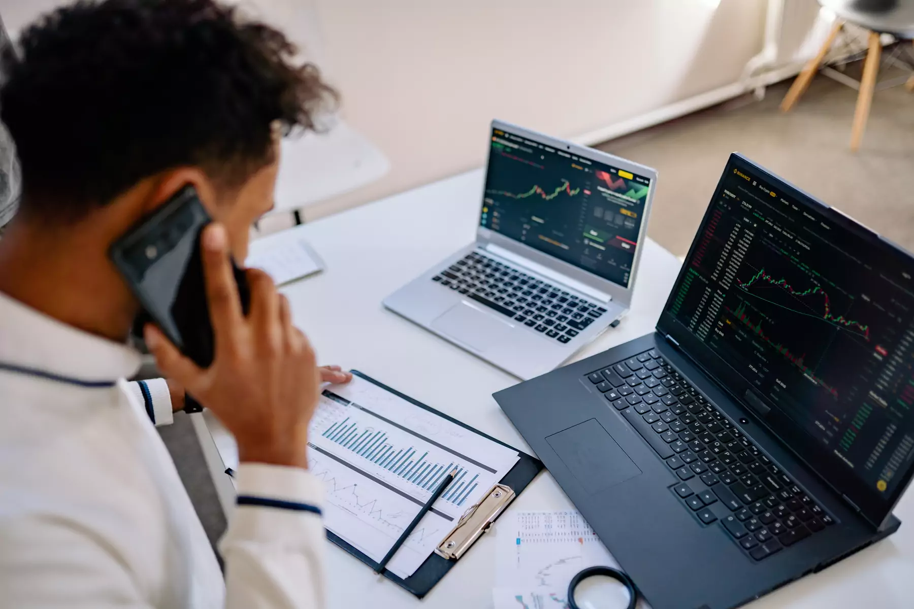 Professional reviewing workforce data on laptops